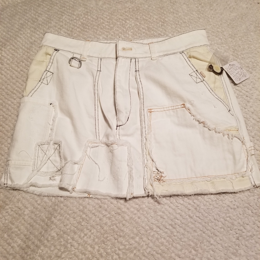 Free People size 31 cream denim distressed skirt.